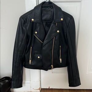 Brand new never worn black leather jacket with gold details. So cute!